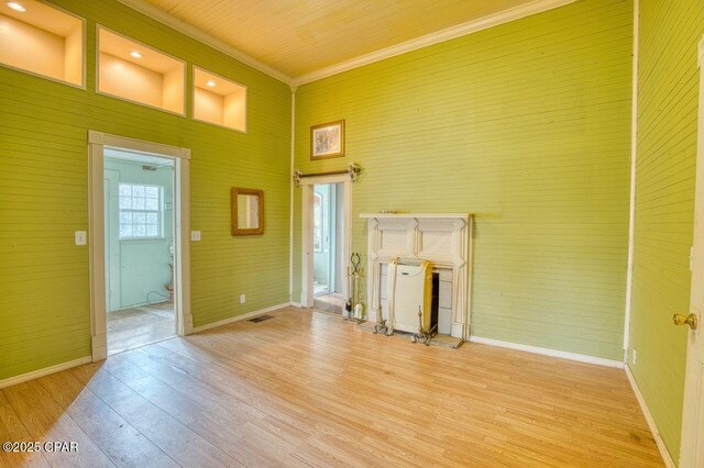 kitchen with backsplash, pendant lighting, a center island, sink, and crown molding