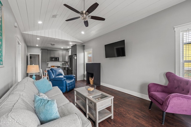 living room featuring ceiling fan, vaulted ceiling, wood ceiling, and dark wood-type flooring