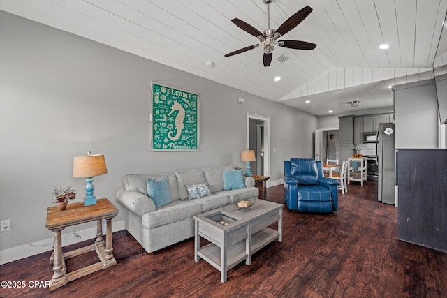 living room featuring ceiling fan, dark wood-type flooring, and lofted ceiling