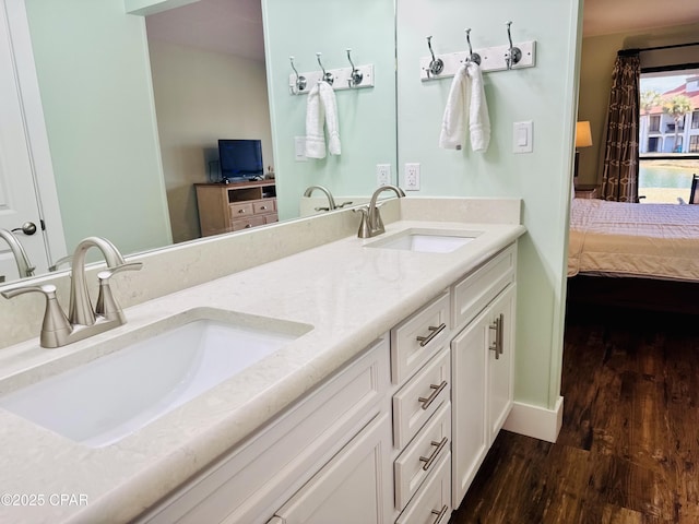 bathroom with vanity and hardwood / wood-style floors