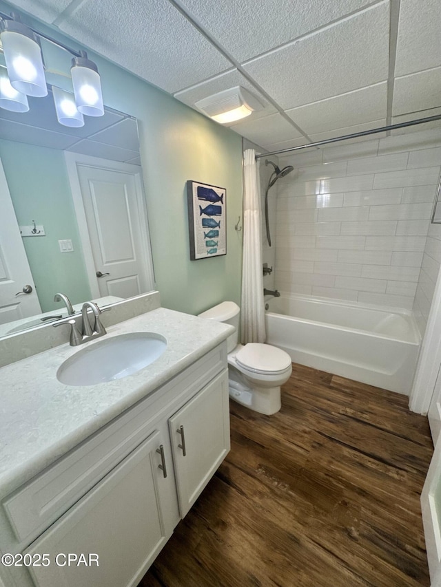 full bathroom featuring vanity, hardwood / wood-style floors, shower / bath combination with curtain, and toilet