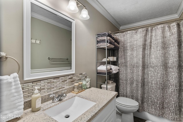 bathroom with toilet, tasteful backsplash, a textured ceiling, crown molding, and vanity