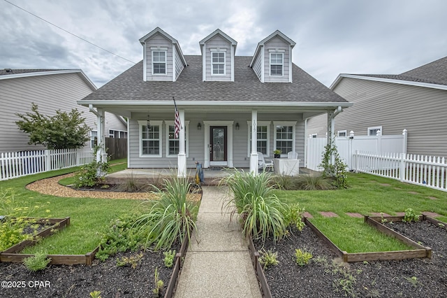 cape cod-style house featuring a front lawn and a porch