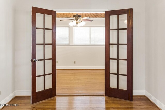 spare room with ceiling fan and wood-type flooring