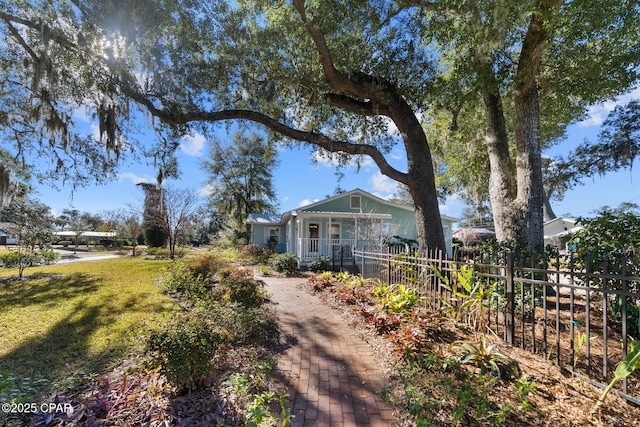 view of front of home with a porch and a front lawn