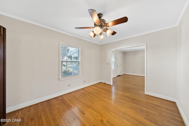 unfurnished room featuring light hardwood / wood-style floors, ornamental molding, and ceiling fan