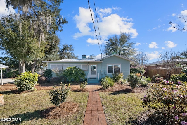 ranch-style house with a front lawn