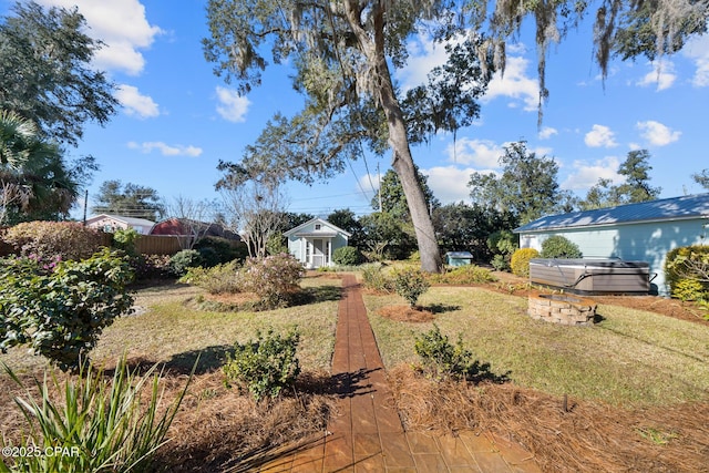 view of yard with a hot tub