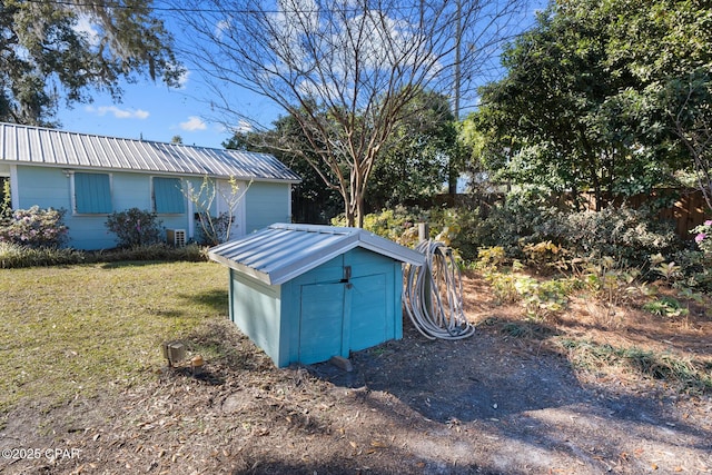 view of outbuilding featuring a yard