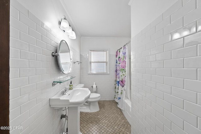 full bathroom with tile patterned flooring, tile walls, toilet, ornamental molding, and shower / tub combo with curtain