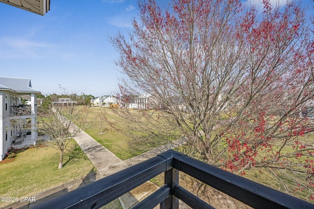 view of yard with a balcony