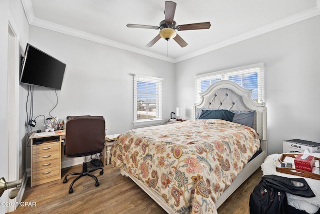 bedroom featuring dark hardwood / wood-style flooring, crown molding, and ceiling fan