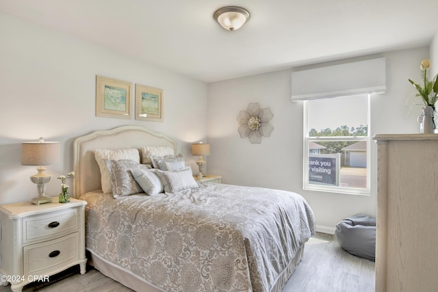 bedroom with light wood-type flooring