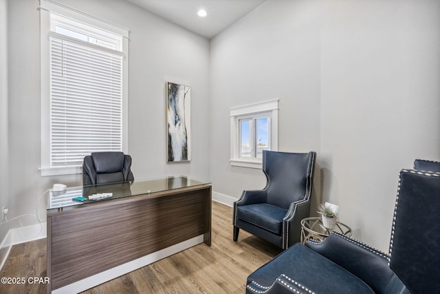 home office with baseboards, wood finished floors, and recessed lighting