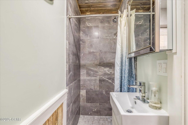 bathroom featuring sink and a shower with curtain