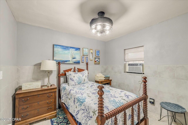 bedroom featuring tile walls, cooling unit, and ceiling fan