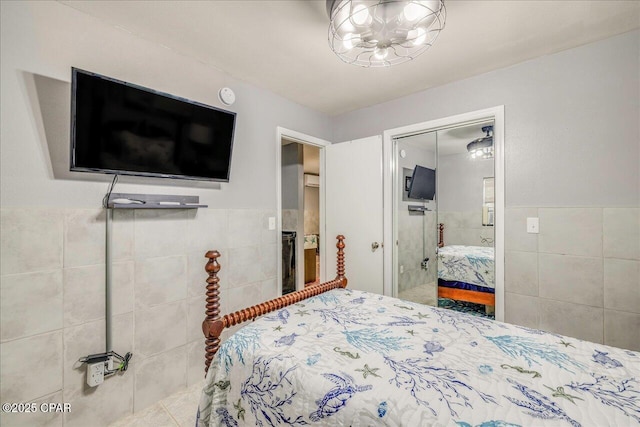 bedroom featuring tile walls