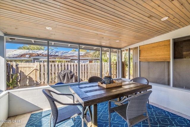 sunroom / solarium featuring wood ceiling