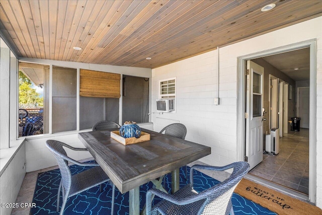 sunroom / solarium featuring cooling unit and wooden ceiling