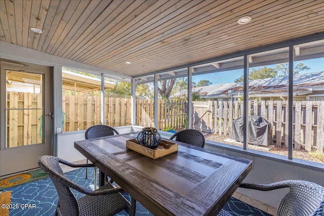 sunroom featuring wood ceiling