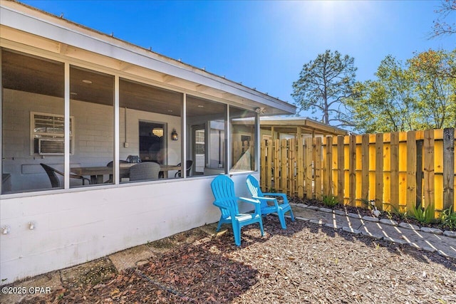 exterior space featuring a sunroom