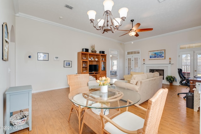 dining room featuring french doors and crown molding