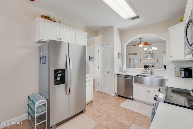 kitchen with backsplash, sink, white cabinetry, and appliances with stainless steel finishes