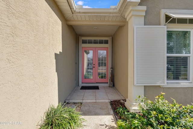 property entrance featuring french doors