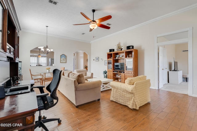 living room with a textured ceiling, crown molding, and ceiling fan with notable chandelier