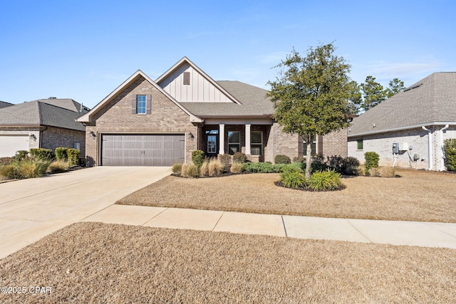 view of front facade featuring brick siding, a shingled roof, concrete driveway, board and batten siding, and a garage