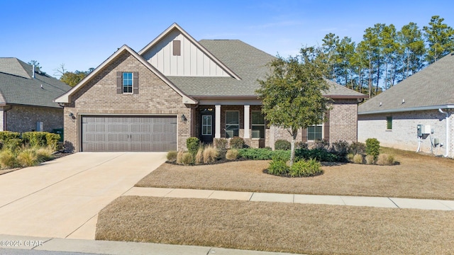 craftsman-style home with brick siding, roof with shingles, board and batten siding, a garage, and driveway