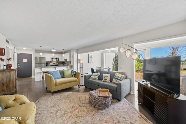 living room featuring a textured ceiling