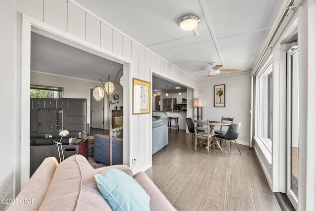 dining space featuring ornamental molding and ceiling fan