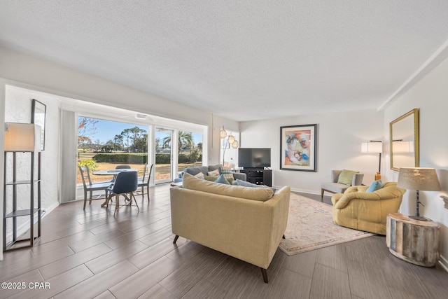 living room with a textured ceiling