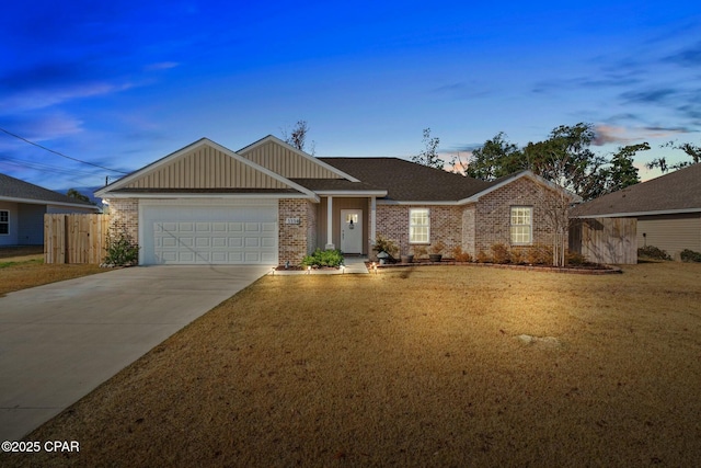 ranch-style house with a garage and a lawn