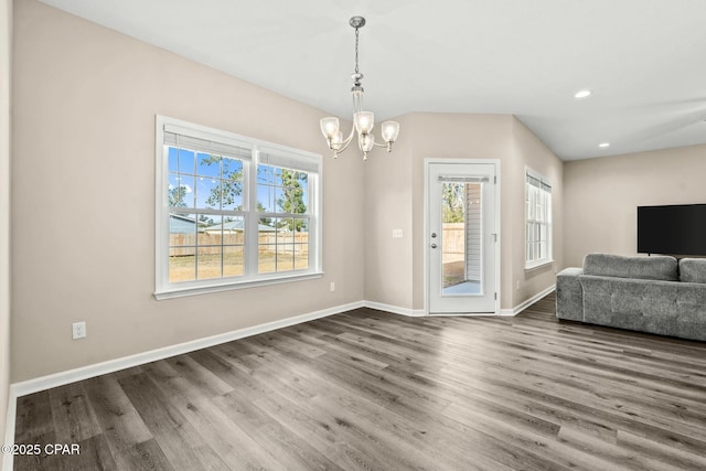 interior space with hardwood / wood-style flooring and a chandelier