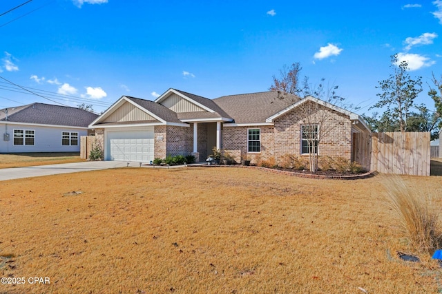 view of front of property featuring a garage and a front lawn