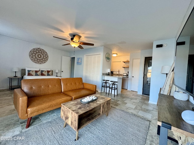 living room featuring ceiling fan