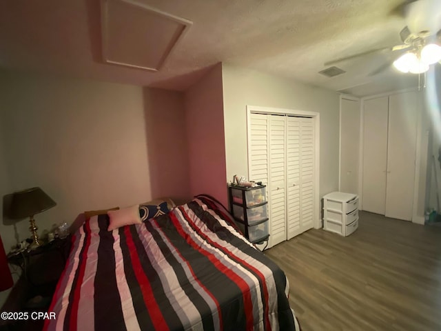 bedroom featuring a closet, ceiling fan, and dark hardwood / wood-style floors