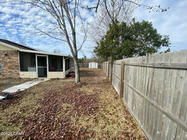 view of yard with a sunroom