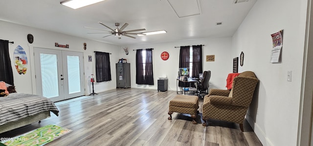 bedroom featuring ceiling fan, access to exterior, french doors, and light wood-type flooring