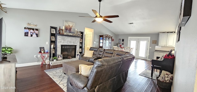 living room featuring ceiling fan, dark hardwood / wood-style flooring, lofted ceiling, and french doors