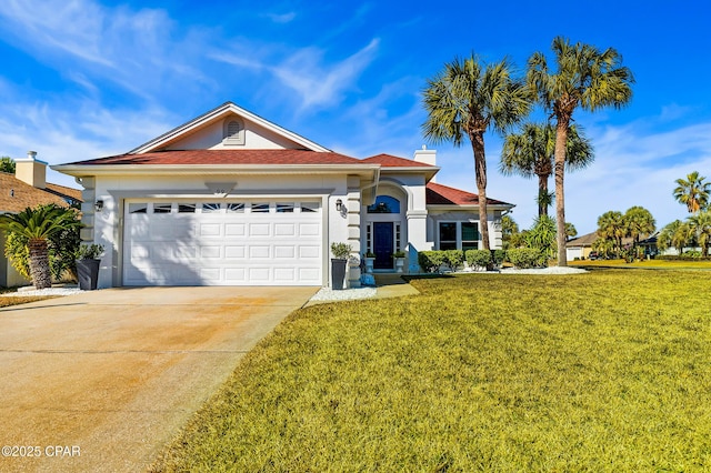 view of front of home featuring a garage and a front lawn