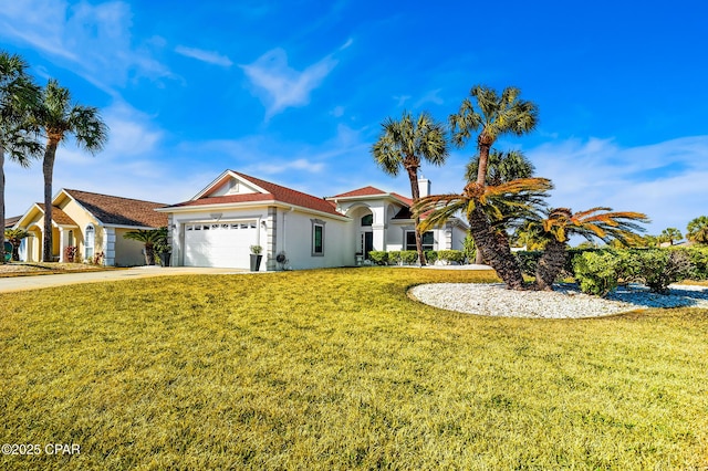 view of front facade featuring a garage and a front yard