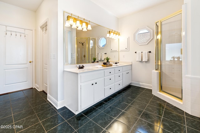 bathroom featuring vanity and a shower with door