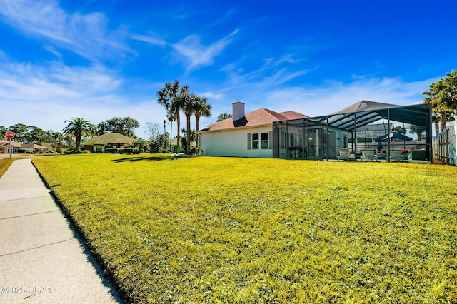 view of yard featuring a lanai