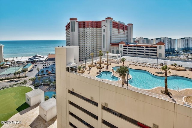 pool with a water view, a city view, and a patio