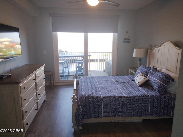 unfurnished bedroom with ceiling fan, access to outside, and dark wood-style flooring