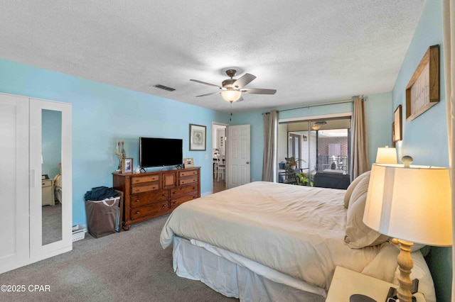 bedroom featuring access to exterior, carpet floors, a textured ceiling, and ceiling fan