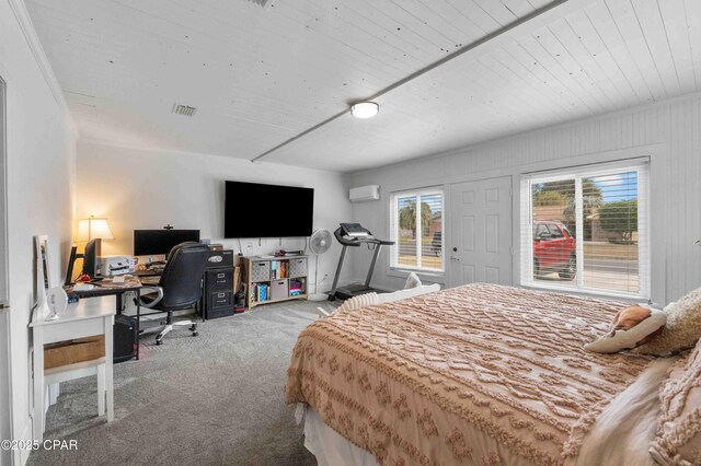 carpeted bedroom with an AC wall unit and wooden ceiling